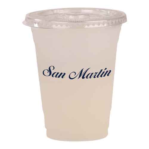 Model wearing light green backpack with black canvas straps and front zipper pouch.